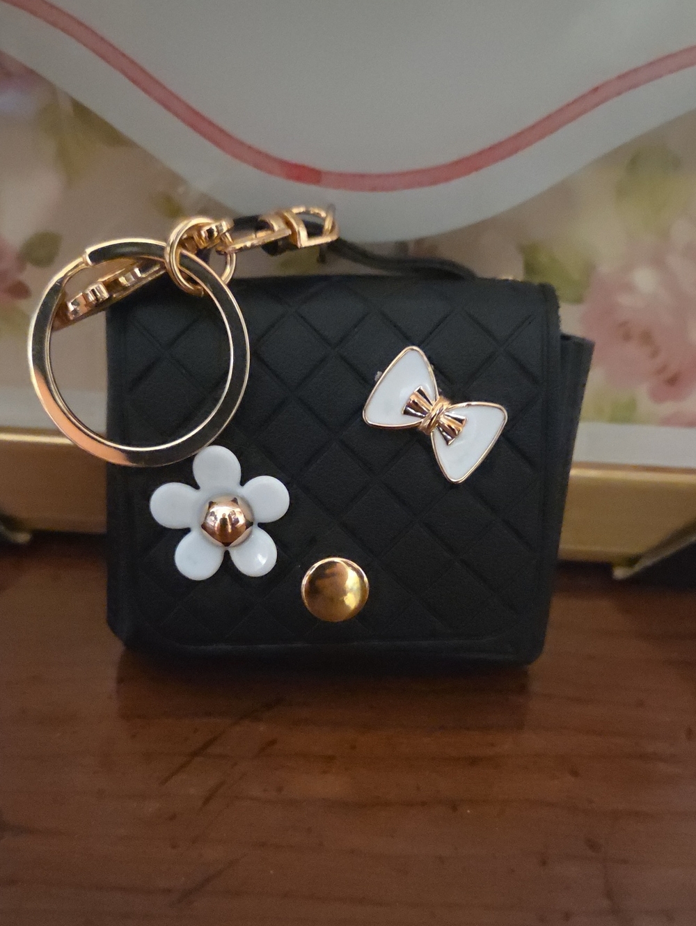 Quilted Black Mini Bag Keychain with Gold Accents and White Bow